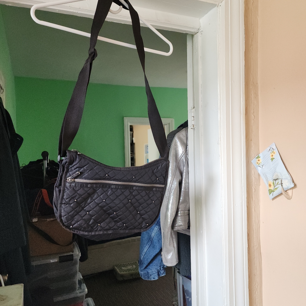 Le Sportsac Is An Elegant Black Quilted Shoulder Bag